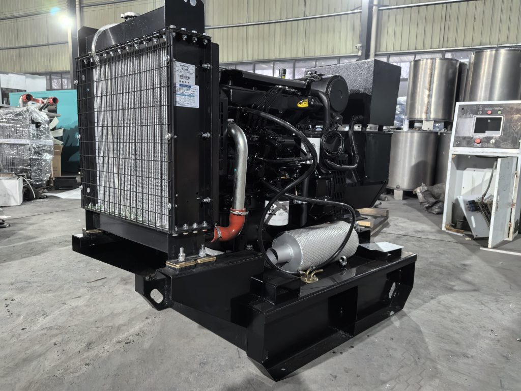 Open-frame diesel generator set on a factory floor showing the radiator core, fan guard and engine block