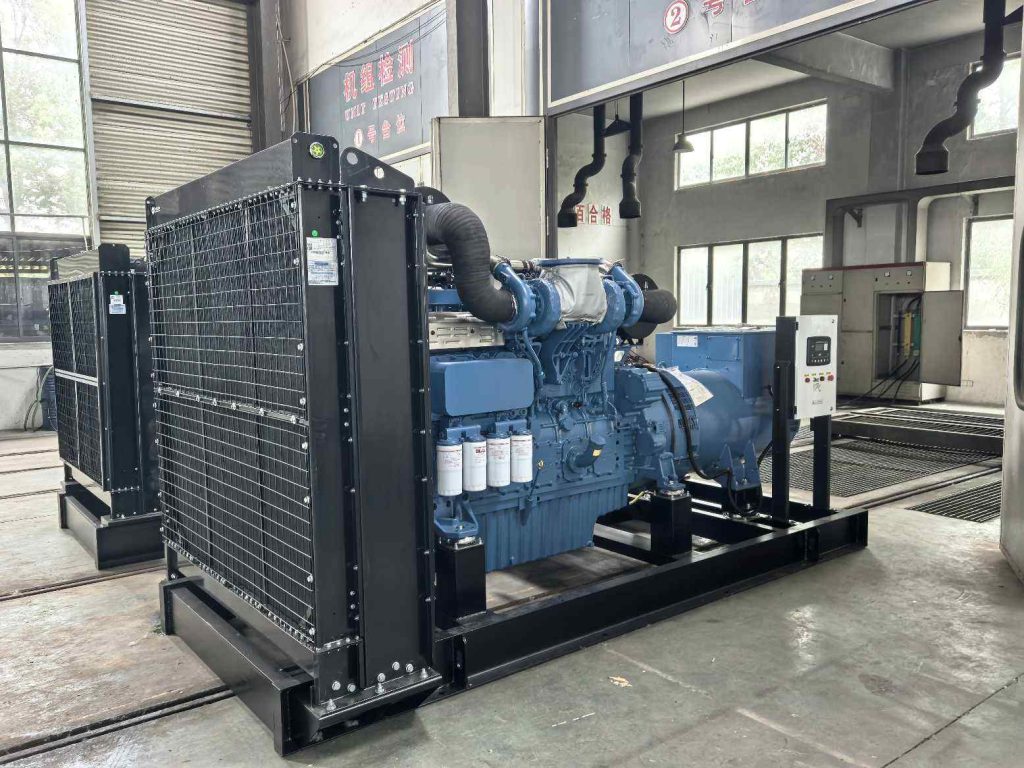 Open frame diesel generator set with radiator and engine exposed on a steel skid inside the assembly workshop